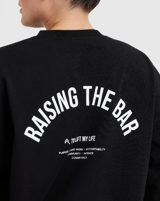 Raising The Bar Graphic Unisex Long Sleeve Top | Black